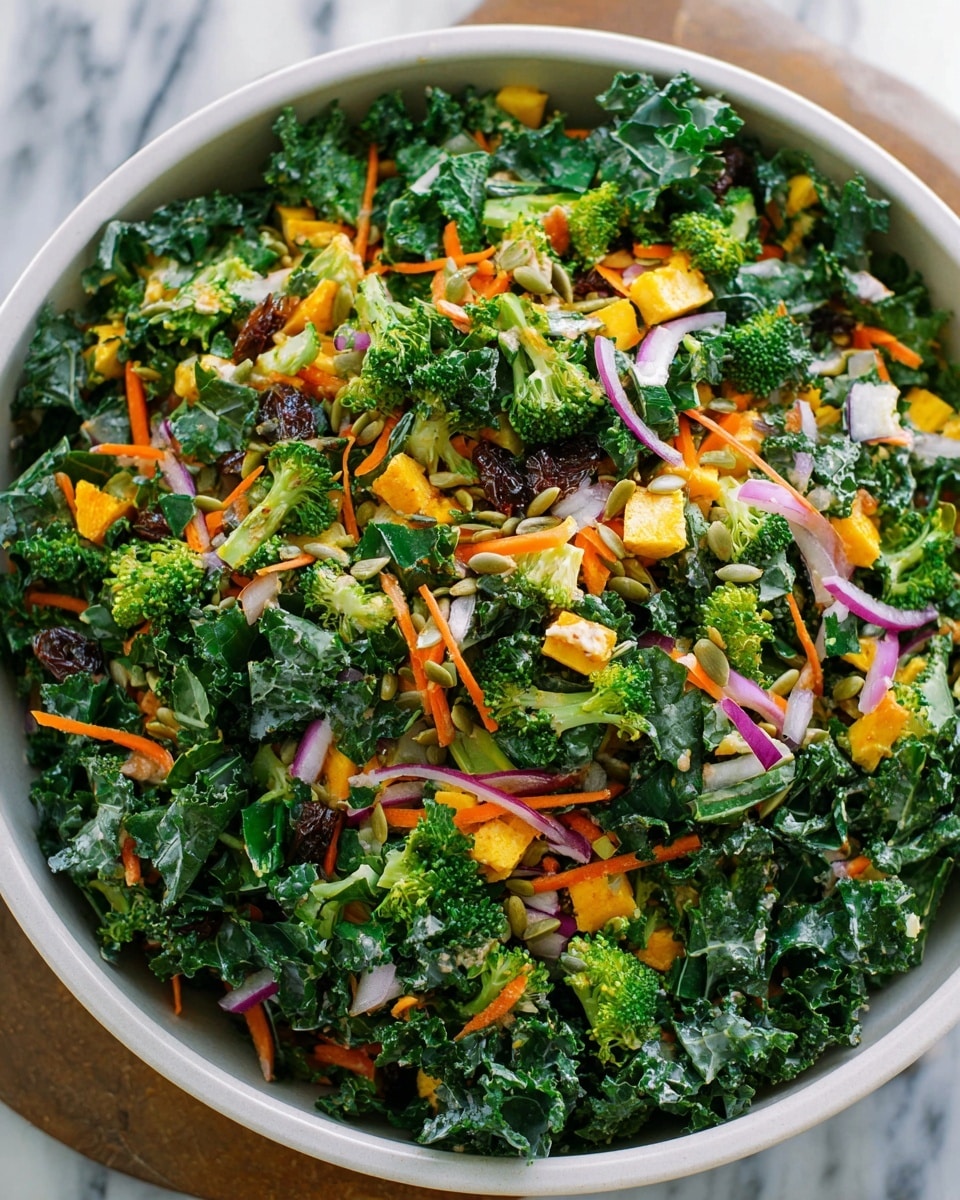 A close-up view of a colorful salad in a white bowl, filled with fresh green kale leaves, bright orange sweet potato cubes, small purple onion pieces, and light brown crunchy bits. A wooden spoon is scooping the salad, showing the mix's rough and leafy texture. The bowl is placed on a white marbled surface, making the vibrant colors of the salad stand out. Photo taken with an iphone --ar 4:5 --v 7