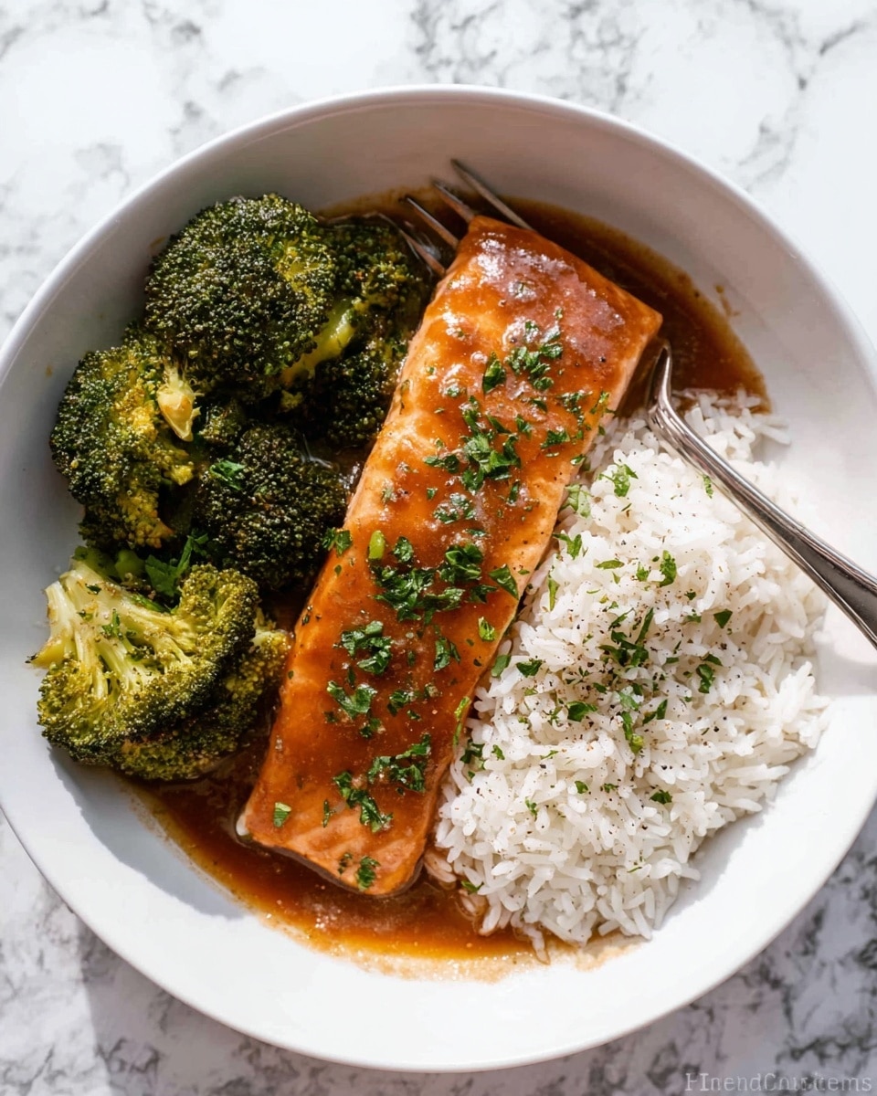 The image shows a white bowl with three main parts. On the left side, there are dark green broccoli florets with a fresh, slightly rough texture. In the center, a rectangular salmon fillet covered with a shiny brown sauce is placed, sprinkled with finely chopped green herbs. On the right side, a mound of white rice sits with scattered herbs and a light sprinkle of black pepper. A silver fork rests partially on the rice and broccoli, leaning against the side of the bowl. The bowl is set on a white marbled surface. Photo taken with an iphone --ar 4:5 --v 7