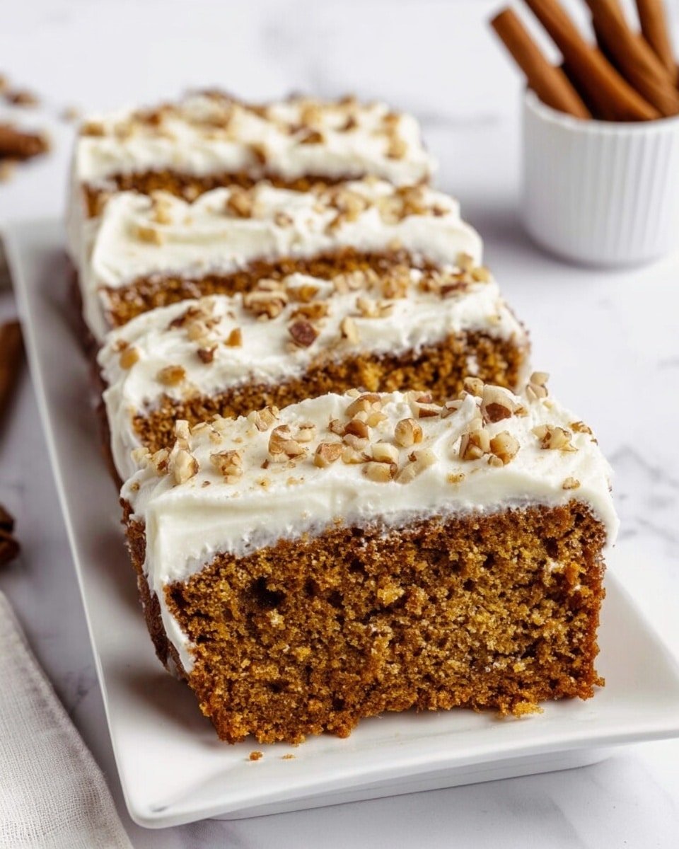 A slice of moist, brown cake with a soft, crumbly texture sits on a white plate with a layer of white cream and chopped pecans in the middle. The cream layer is thick and creamy, spreading out and holding the pecans, with crumbs and small pieces of pecans scattered on the plate. A bronze spoon holds a bite-sized piece of the cake with cream and nuts, resting near the slice. The background shows more slices of the cake on similar white plates, all placed on a white marbled surface. photo taken with an iphone --ar 4:5 --v 7