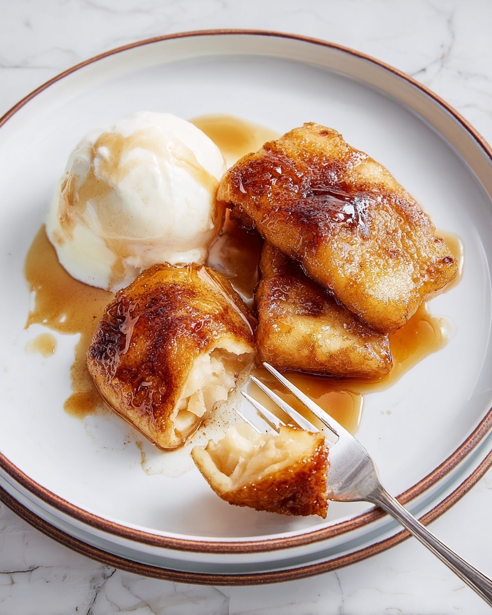 On a white plate with a thin brown rim, there are three pieces of golden brown fried dessert with a caramelized, crispy texture on top. Beside them is a scoop of white vanilla ice cream, slightly melting and topped with a light drizzle of brown sauce. A silver fork holds a piece of the fried dessert, showing its soft, light inside. The plate is on a white marbled surface, and the photo is bright with natural light. Photo taken with an iphone --ar 4:5 --v 7