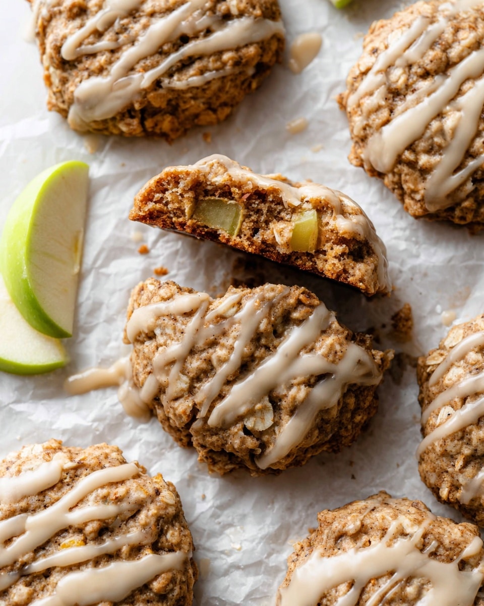 A white round plate with a brown decorative rim holds eight oatmeal cookies, each about one layer thick with a rough, crumbly texture and golden brown color mixed with darker spots from oats and nuts. On top of each cookie, there is a light beige drizzle of icing applied unevenly in thin and thick lines, creating a shiny contrast on the matte surface of the cookies. The plate rests on a white marbled surface, with a green cloth partially visible near the bottom left. A white speckled cup filled with coffee is seen at the top left corner of the image. photo taken with an iphone --ar 4:5 --v 7