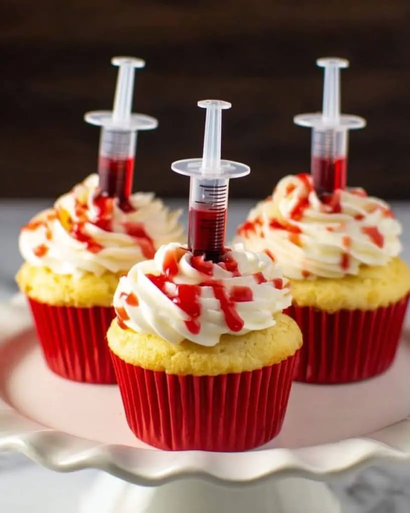 Bloody Cupcakes: Vanilla Cupcakes Filled with Strawberry Coulis and Buttercream Frosting Recipe