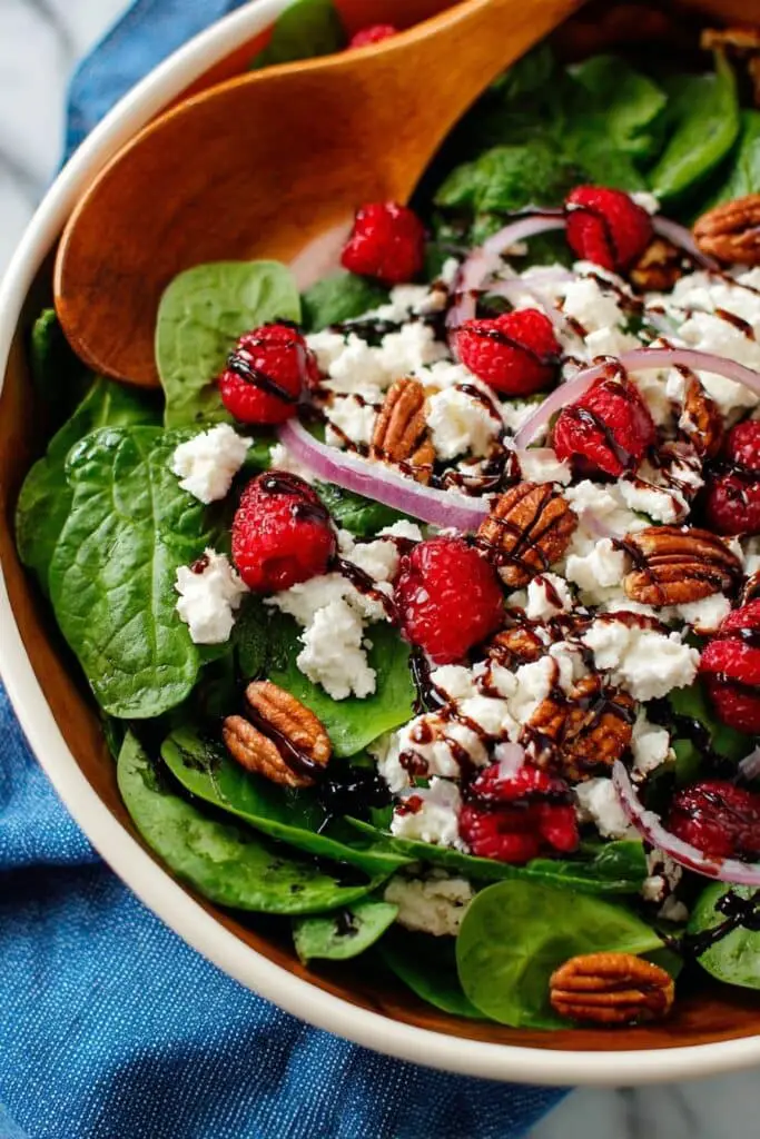 Sweet and Tangy Spinach Salad with Goat Cheese, Raspberries, and Toasted Pecans Recipe
