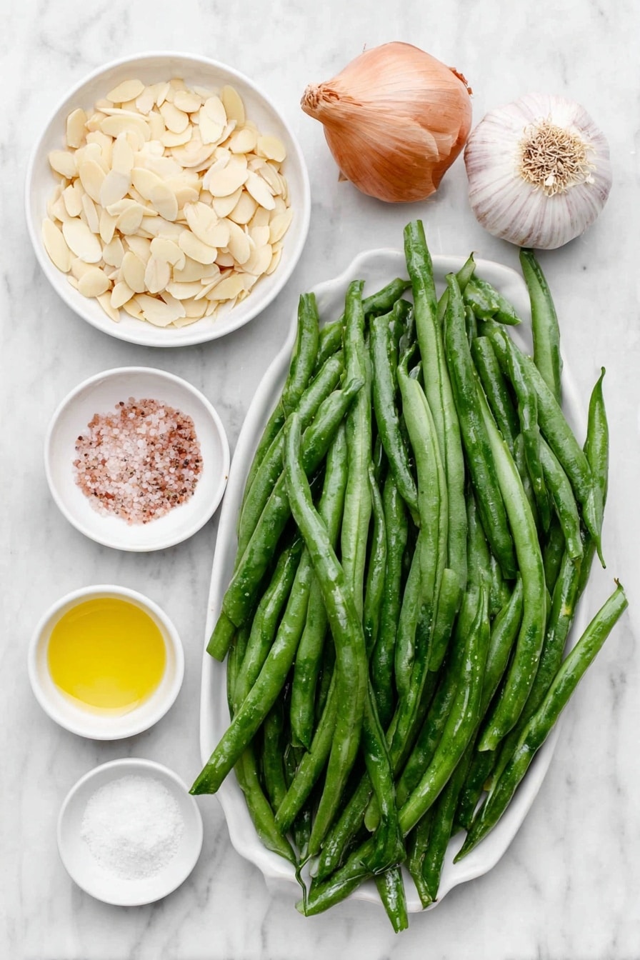 Flat lay of fresh haricot vert green beans trimmed and blanched, a small pile of golden toasted sliced almonds, a small white bowl of extra-virgin olive oil, a whole uncracked shallot, a small white bowl of sea salt, a whole garlic clove, a small white bowl of fresh lemon juice, and a few cracks of freshly ground black pepper arranged perfectly symmetrically on simple white ceramic dishes and bowls, placed on a clean white marble surface, soft natural light, photo taken with an iPhone, professional food photography style, fresh ingredients, white ceramic bowls, no bottles, no duplicates, no utensils, no packaging --ar 2:3 --v 7 --p awthu7i m7354615311229779997 - Green Beans Almondine with Toasted Almonds, green beans almondine, lemon green bean side dish, almond-sautéed green beans, elegant vegetable side dish