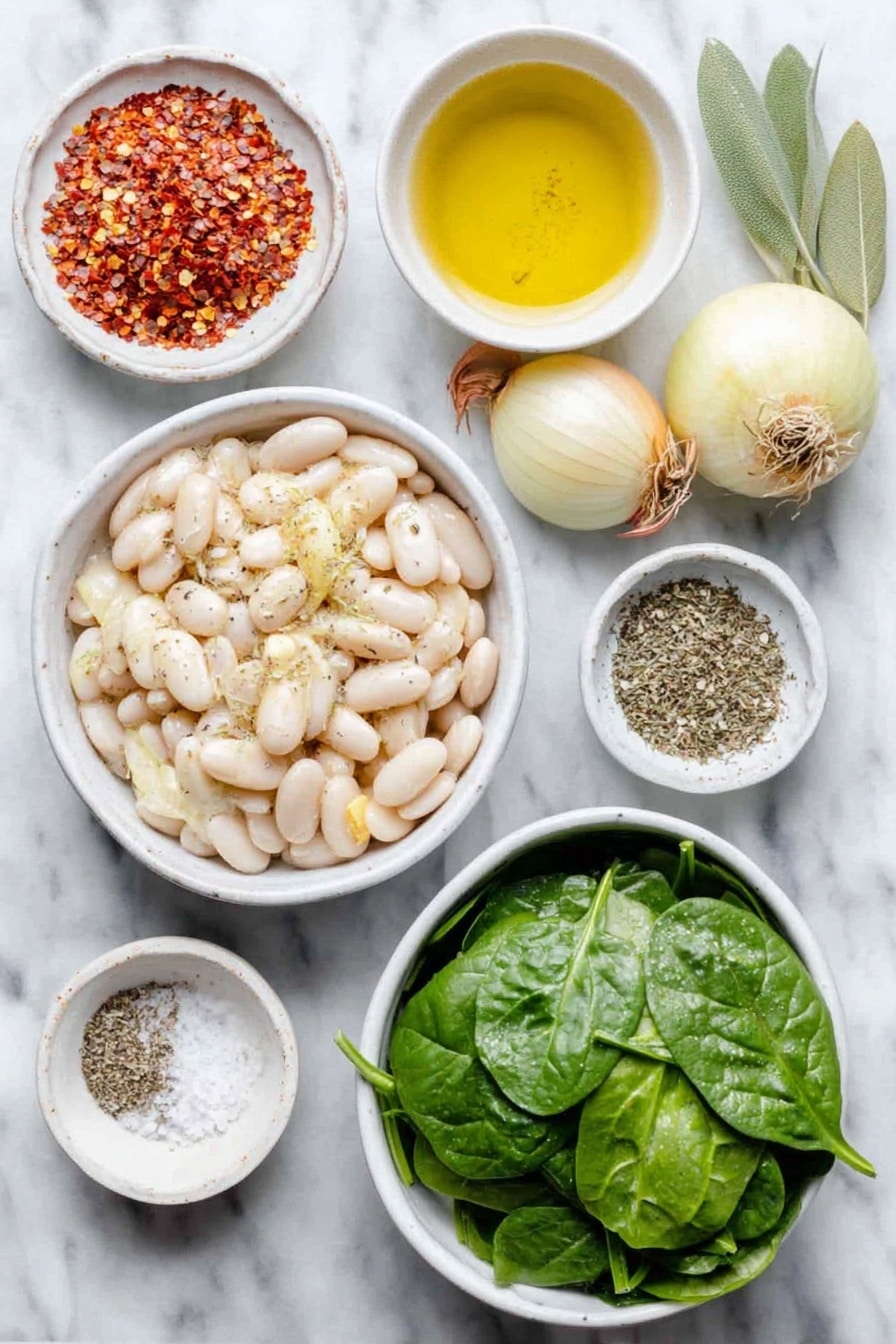 Flat lay of a small white ceramic bowl of extra virgin olive oil, a small peeled onion, two medium shallots with papery skins, four whole garlic cloves, two sliced carrots cut into coins, two diced celery stalks, a large white ceramic bowl of drained white cannellini beans, two fresh green bay leaves, a small white bowl of dried Italian seasoning herbs, a small white bowl of red pepper flakes, a large white ceramic bowl of fresh vibrant green spinach leaves, a small white bowl of coarse sea salt, and a small white bowl of ground black pepper all arranged symmetrically placed on a clean white marble surface, soft natural light, photo taken with an iPhone, professional food photography style, fresh ingredients, white ceramic bowls, no bottles, no duplicates, no utensils, no packaging --ar 2:3 --v 7 --p awthu7i m7354615311229779997 - Tuscan White Bean Soup, hearty Italian soup, easy white bean soup, vegetarian Italian soup, comforting bean soup
