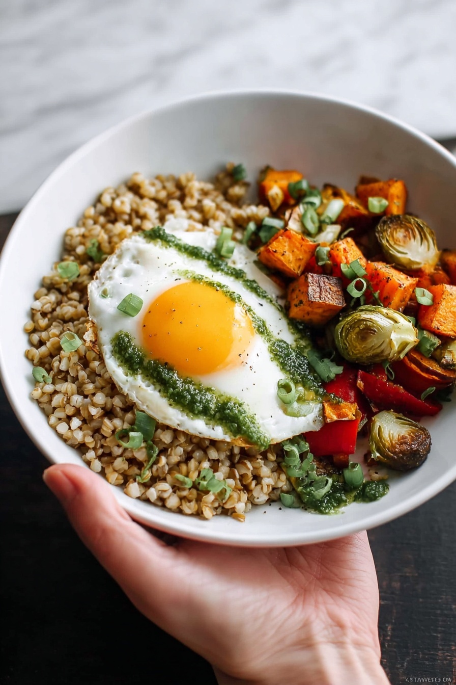 A white bowl is filled with three main layers: on the left, a bed of cooked brown grains with a slightly moist texture, topped with small green herb pieces; next to it, a colorful mix of roasted vegetables including red bell peppers, Brussels sprouts halved and light green inside, orange sweet potato cubes, and chunks of red onion; on top of the vegetables rests a fried egg with a bright yellow runny yolk spilling onto the vegetables and grains, with green herb sauce drizzled on the egg white. A fork is pulling into the yolk from the bottom left of the bowl, held by a woman's hand. The bowl sits on a white marbled textured cloth background with a bit of wooden surface showing. Photo taken with an iphone --ar 2:3 --v 7 - Roasted Vegetable Grain Bowl with Egg, healthy grain bowl recipes, vegetarian roasted veggie bowls, easy wholesome lunch ideas, nutritious egg bowls