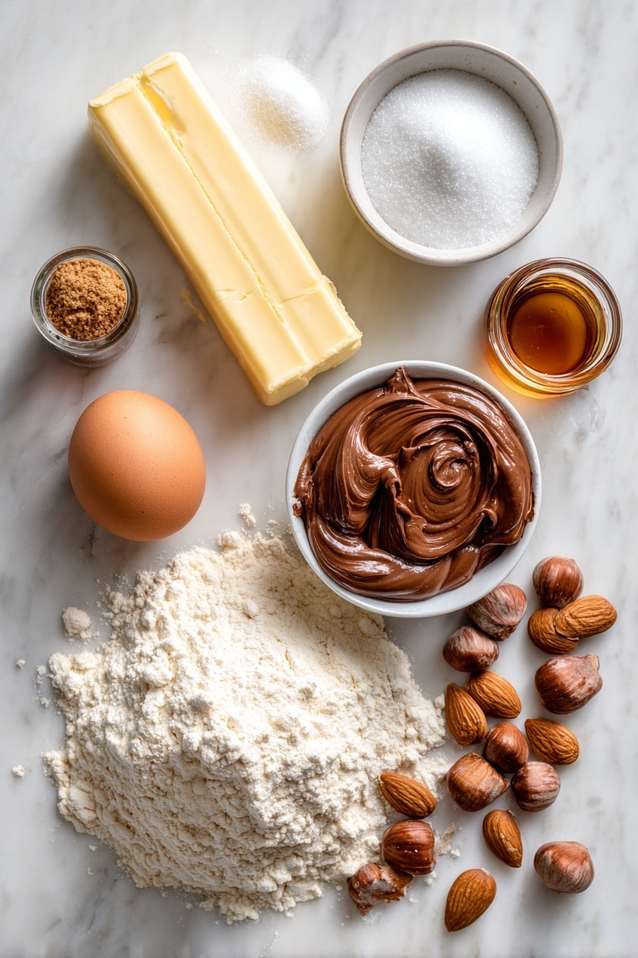 Flat lay of a stick of unsalted butter, a small pile of white sugar, a few spoonfuls of brown sugar, a single large egg, a small glass bottle of vanilla extract, a bowl of flour with visible texture, a dollop of smooth Nutella hazelnut spread, and a scattering of almond nuts, all beautifully arranged on a white marble surface, photo taken with an iphone --ar 2:3 --v 7 - Nutella Thumbprint Cookies, chocolate hazelnut cookies, easy cookie recipes, soft chewy cookies, homemade thumbprint cookies