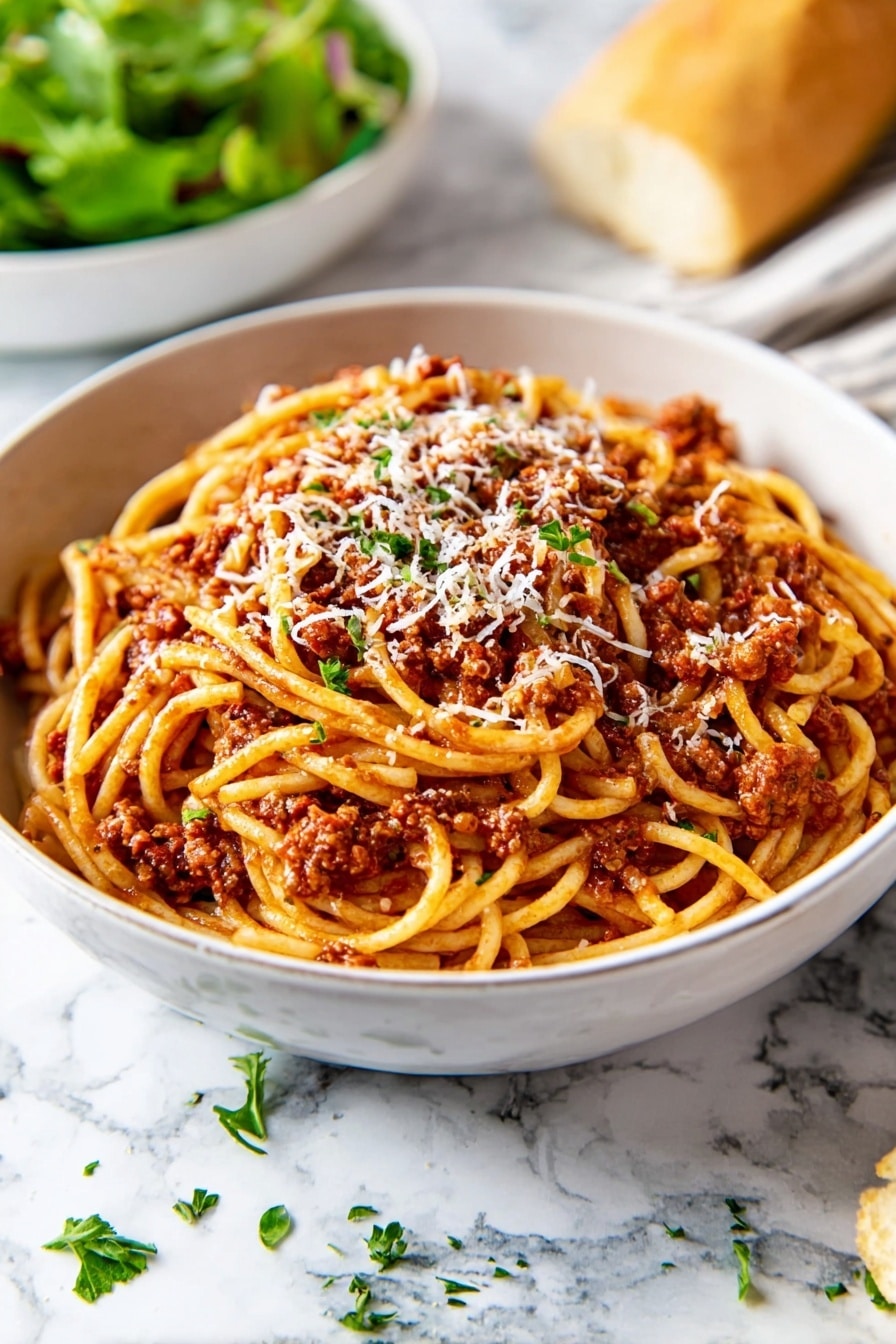 A white bowl filled with spaghetti covered in a rich, reddish-brown meat sauce. The spaghetti noodles are twisted around a silver fork held by a woman's hand above the bowl, showing the sauce and bits of meat clinging to the strands. Some grated cheese is sprinkled lightly over the top. In the blurry background, there is a piece of bread and a small bowl with green herbs on a white marbled surface. The overall scene is brightly lit and focuses closely on the forkful of spaghetti photo taken with an iphone --ar 2:3 --v 7 - Slow Cooker Bolognese Sauce, easy Italian pasta sauce, hearty slow cooker dinner, flavorful Bolognese recipe, simple ground meat sauce