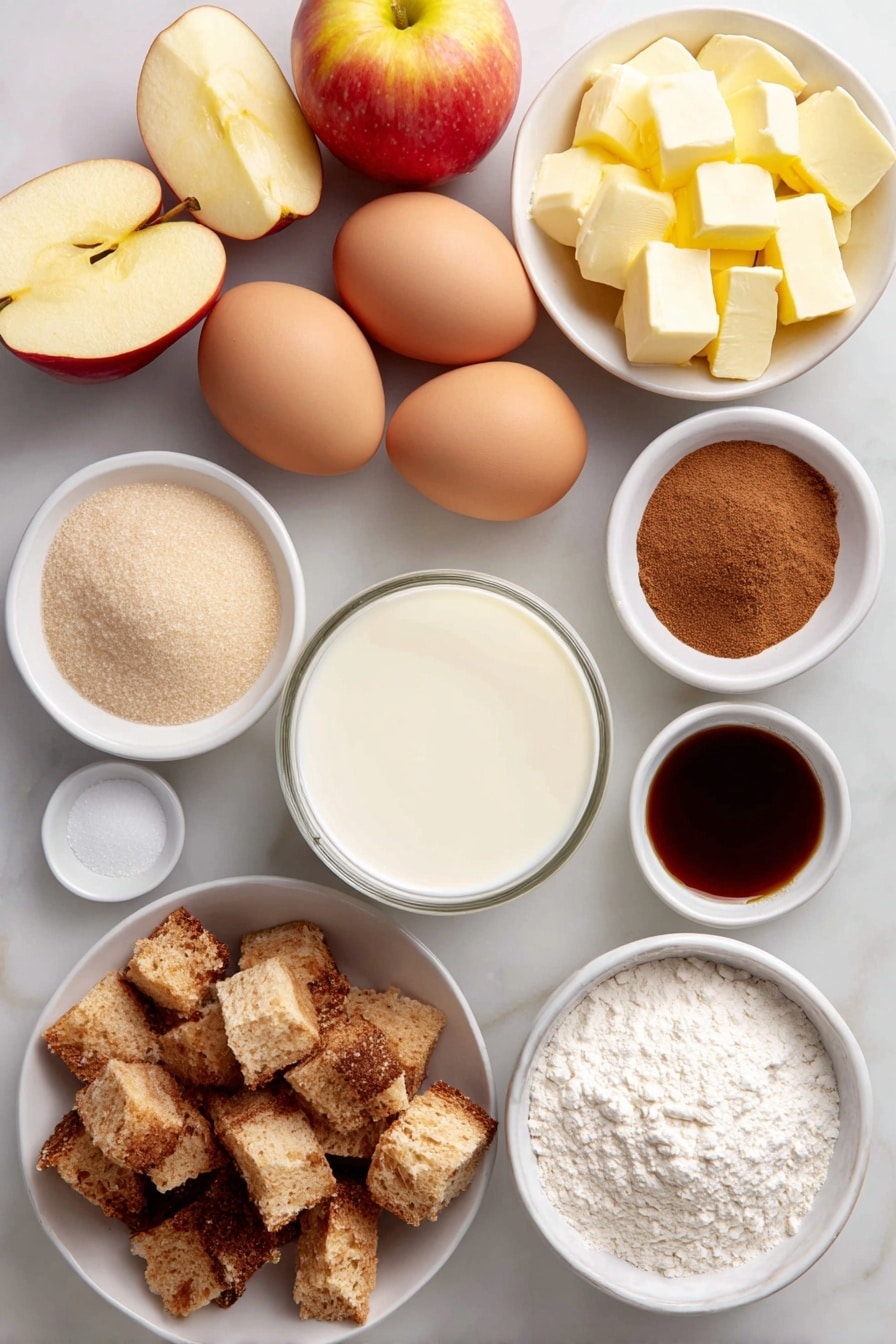 Flat lay of peeled, cored, and sliced fresh apples arranged neatly, diced rustic French bread cubes, six whole large eggs with clean shells, a small white ceramic bowl of whole milk, a small white ceramic bowl of heavy cream, a small white ceramic bowl filled with granulated sugar, a small white ceramic bowl with light brown sugar, a small white ceramic bowl containing all-purpose flour, a small white ceramic bowl holding ground cinnamon, a small white ceramic bowl with ground nutmeg, diced salted butter cubes arranged artfully on a simple white ceramic plate, and a small white ceramic bowl of clear vanilla extract placed symmetrically, all on a clean white marble surface, soft natural light, photo taken with an iPhone, professional food photography style, fresh ingredients, white ceramic bowls, no bottles, no duplicates, no utensils, no packaging --ar 2:3 --v 7 --p awthu7i m7354615311229779997 - Apple French Toast Casserole, cinnamon apple breakfast bake, make-ahead apple casserole, cozy breakfast recipes, easy apple brunch idea