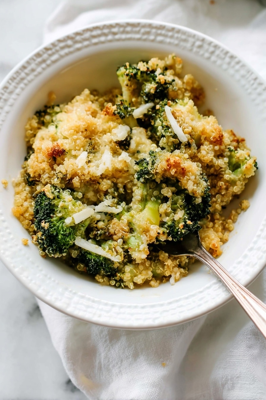 A white bowl holds a serving of broccoli quinoa casserole with three visible layers: at the bottom is a soft, light green layer of small broccoli florets, followed by a layer of fluffy beige quinoa mixed with broccoli, and topped with a golden-brown crumbly layer mixed with melted cheese and crispy bits. A silver fork pierces into the top layer, lifting a piece of broccoli covered with the crunchy topping. In the background, a white casserole dish with more broccoli quinoa bake is partially visible on a white marbled surface with some crumbs scattered around. Photo taken with an iphone --ar 2:3 --v 7 - Better Broccoli Casserole, broccoli casserole recipe, cheesy broccoli bake, healthy broccoli casserole, easy vegetable casserole