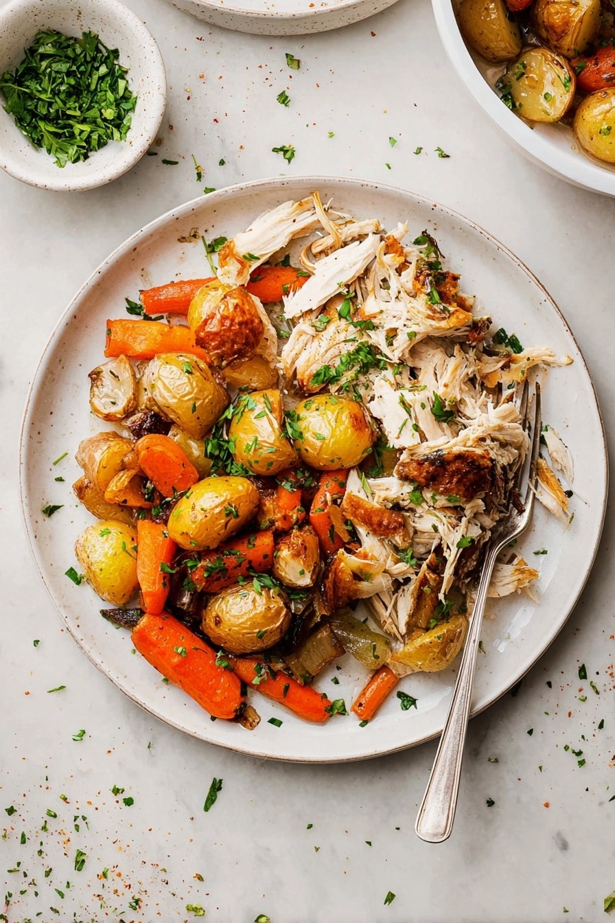 The dish shows a white round plate filled with two main layers: on the left side, there is shredded white meat with golden-brown skin pieces scattered on top, adding texture and color contrast; on the right side, there is a mix of roasted vegetables including small golden-brown potatoes, bright orange carrot pieces, and browned onions, all lightly charred and scattered with chopped green herbs for freshness. A silver fork rests partly on the plate’s edge, pointing inward. Above and behind the plate, a small white bowl with chopped green herbs is visible, placed on a white marbled surface scattered with a few herbs and seasoning bits. Photo taken with an iphone --ar 2:3 --v 7 - Slow Roasted Whole Chicken with Herbs and Vegetables, roasted chicken, herb-infused chicken, easy roasted chicken recipe, family dinner ideas