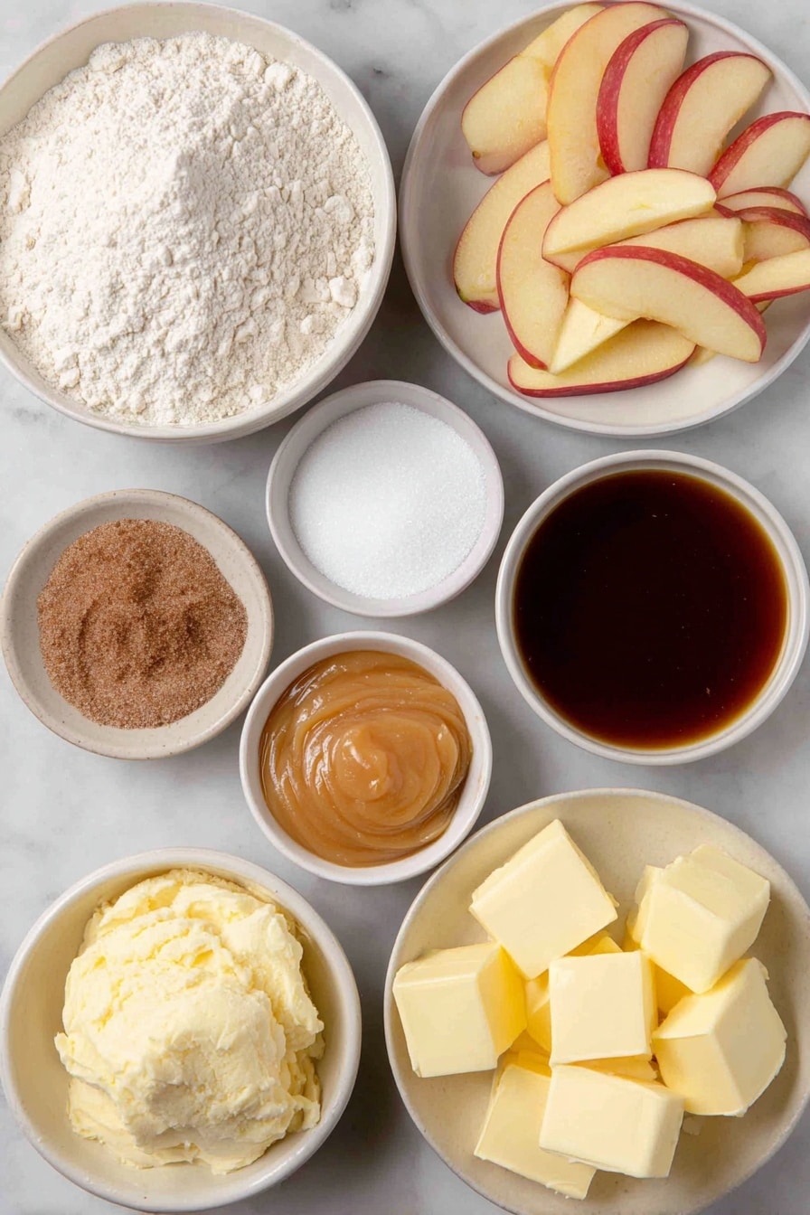 Flat lay of a small mound of all-purpose flour, a few tablespoons of granulated sugar in a small white bowl, a small heap of active dry yeast granules, a pinch of salt in a tiny white bowl, a small white bowl with water, a small white bowl with milk, cubes of fresh butter, several peeled and thinly sliced tart apples arranged neatly, a small white bowl with brown sugar, a small white bowl with caramel ice cream topping, a small white bowl of ground cinnamon, a small white bowl containing a mixture of flour and sugar, and cold butter cubes grouped together, placed on a clean white marble surface, soft natural light, photo taken with an iPhone, professional food photography style, fresh ingredients, white ceramic bowls, no bottles, no duplicates, no utensils, no packaging --ar 2:3 --v 7 --p awthu7i m7354615311229779997 - Apple Pizza with Cream Cheese, Cinnamon Apples, Streusel Topping, apple dessert pizza, easy fruity dessert recipe