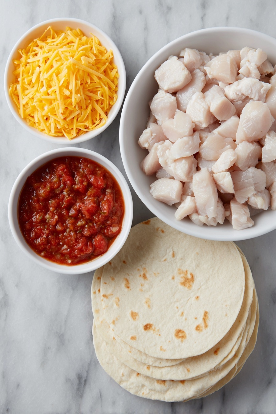 Flat lay of diced cooked chicken in a simple white ceramic bowl, a small white bowl filled with vibrant red salsa, a small white bowl holding bright orange shredded sharp cheddar cheese, a stack of fresh, soft flour tortillas slightly fanned out, placed on a clean white marble surface, soft natural light, photo taken with an iPhone, professional food photography style, fresh ingredients, white ceramic bowls, no bottles, no duplicates, no utensils, no packaging --ar 2:3 --v 7 --p m7354615311229779997 - Easy Chicken Quesadilla Casserole, chicken quesadilla casserole, cheesy chicken bake, quick dinner recipes, family-friendly casseroles