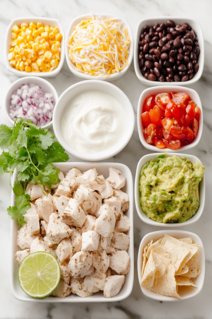 Flat lay of cubed cooked chicken breast, a small bowl of black beans, a small bowl of corn kernels, a small bowl of diced tomatoes, a small bowl of diced red onion, a small bowl of shredded cheddar cheese, a few sprigs of fresh cilantro, a small bowl of plain Greek yogurt, a small bowl of low sugar BBQ sauce, a halved lime with visible juice, diced avocado pieces, and a small pile of crushed tortillas, all arranged symmetrically in simple white ceramic bowls and plates, placed on a clean white marble surface, soft natural light, photo taken with an iPhone, professional food photography style, fresh ingredients, white ceramic bowls, no bottles, no duplicates, no utensils, no packaging --ar 2:3 --v 7 --p m7354615311229779997 - Southwest Chicken Salad, Mexican chicken salad, healthy chicken salad, easy dinner recipes, high-protein salads