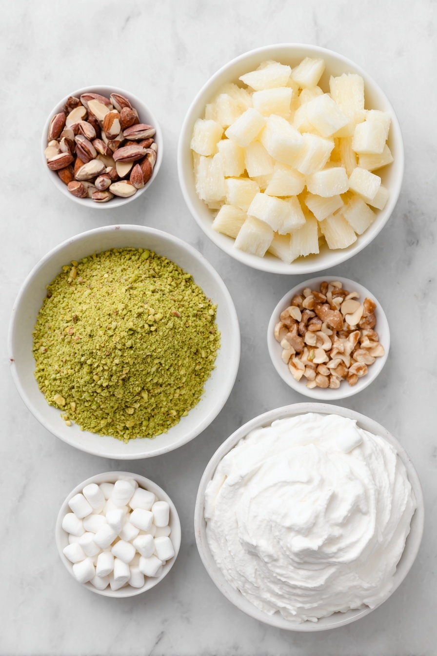 Flat lay of a small mound of bright green pistachio pudding powder, a simple white ceramic bowl filled with crushed pineapple chunks with juice, a small white bowl overflowing with white miniature marshmallows, scattered light brown chopped nuts, and a neat dollop of fluffy white whipped topping arranged on a simple white ceramic plate, all placed on a clean white marble surface, soft natural light, photo taken with an iPhone, professional food photography style, fresh ingredients, white ceramic bowls, no bottles, no duplicates, no utensils, no packaging --ar 2:3 --v 7 --p m7354615311229779997 - Easy Watergate Salad, Watergate Salad, Retro Green Jello Salad, No-Bake Fruit Salad, Fast Dessert Recipes