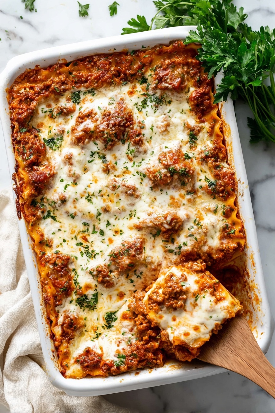 A close-up view of a lasagna dish inside a white baking dish, showing multiple layers of pasta, meat sauce, and melted white cheese on top. The top cheese layer is smooth and creamy with hints of browned spots and small green herb pieces sprinkled across. The meat sauce looks rich and chunky with a reddish-brown color mixed with bits of orange from melted cheese inside. A wooden spoon is lifting a portion, revealing several pasta sheets coated in sauce and melted cheese, with the woman's hand holding the spoon partly visible on the right side. The dish sits on a white marbled surface. photo taken with an iphone --ar 2:3 --v 7 - Cheesy Baked Ravioli with Meat Sauce, baked ravioli recipes, cheesy pasta bake, hearty meat sauce pasta, easy baked ravioli dish