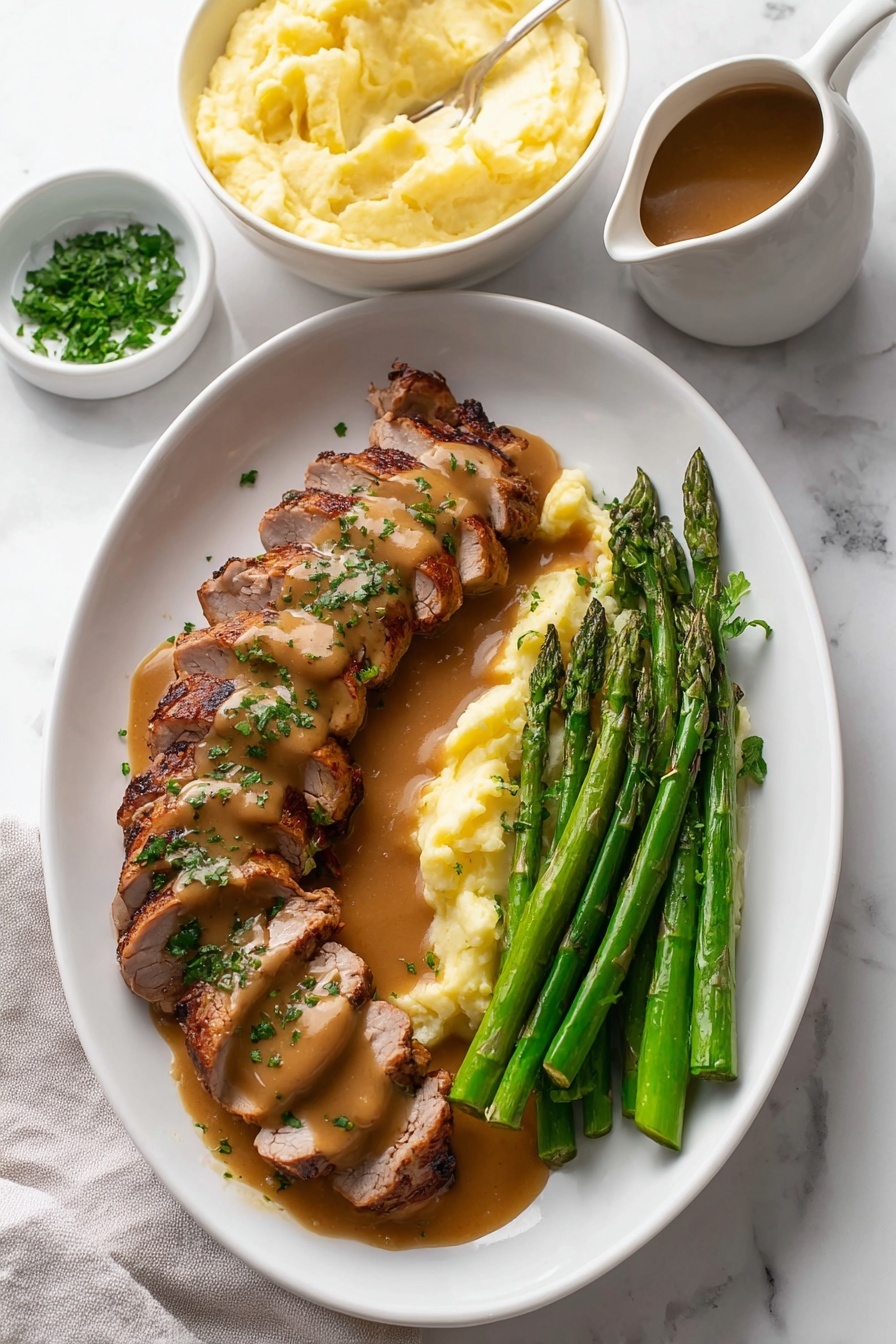 The image shows a white oval plate on a white marbled surface with sliced grilled meat arranged in two rows on the left side. The meat is covered with a smooth brown sauce and sprinkled with chopped green herbs. Next to the meat on the right side are several steamed asparagus spears that are bright green and glossy. Behind the meat and asparagus, there is a white bowl filled with creamy pale yellow mashed potatoes with a slightly uneven smooth surface. In the top left corner on the white marbled surface is a small white bowl with fresh chopped herbs. On the bottom right corner, a white pitcher contains more brown sauce, partially visible. The photo has soft lighting and a clean, fresh presentation style. Photo taken with an iphone --ar 2:3 --v 7 - Garlic Turkey Tenderloin with Easy Gravy, turkey tenderloin recipe, quick turkey dinner, flavorful turkey main dish, easy turkey gravy