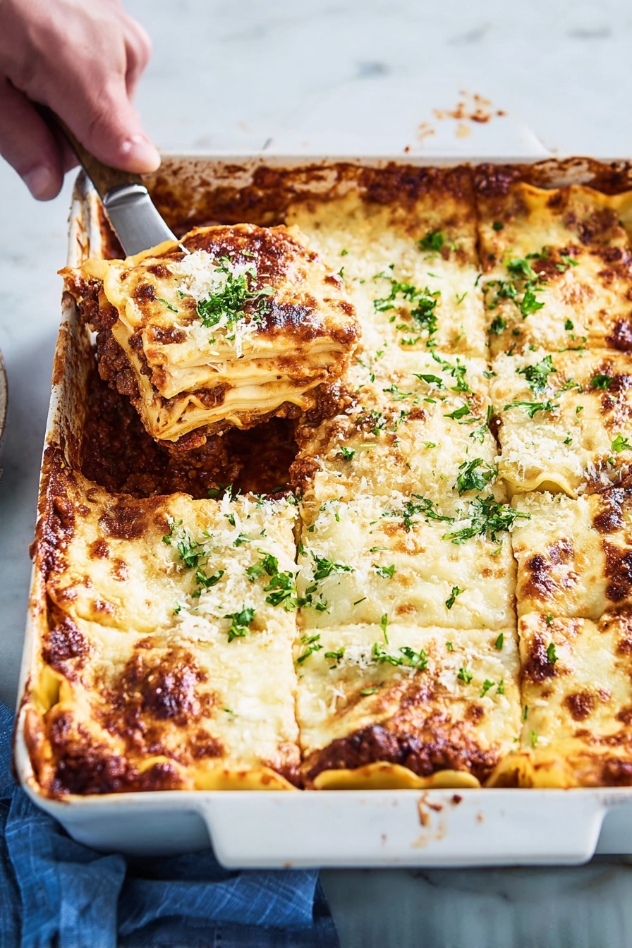 A white rectangular ceramic baking dish holds a layered lasagna with six visible sections. The top layer is melted, golden-brown cheese with some darker browned spots along the edges and sprinkled with fresh green parsley. Underneath the cheese, there are thick, creamy white sauce layers alternating with pasta sheets, visible along the edges where the cheese has browned. Between the pasta layers, a rich dark brown meat sauce with a slightly chunky texture peeks through the sides. A woman's hand is holding a spatula lifting one lasagna piece from the top left corner, showing the thick layers clearly. The dish rests on a white marbled surface with a blue cloth partially visible on the side photo taken with an iphone --ar 2:3 --v 7 - Zucchini Lasagna with Meat Sauce, healthy zucchini lasagna, low-carb zucchini lasagna, gluten-free zucchini lasagna, easy zucchini lasagna recipe
