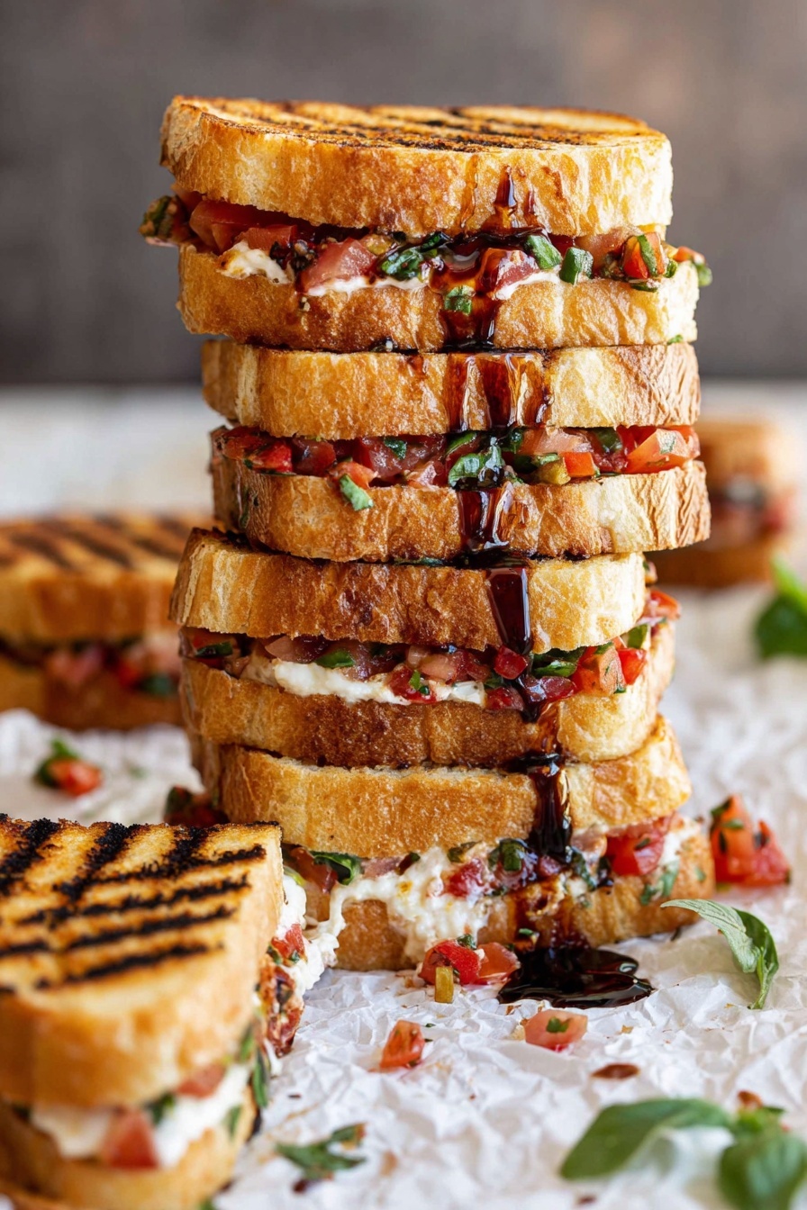 A tall stack of grilled sandwiches with four layers of golden toasted bread, each layer filled with finely chopped red tomatoes, green herbs, and melted light cream cheese, with dark brown balsamic glaze drizzled over the top and sides. The sandwiches show clear grill marks and are placed on crumpled white parchment paper with scattered bits of tomato and herbs around, on a white marbled surface. To the side, a single smaller sandwich with the same fillings is laid down, showing the textured toasted bread and filling clearly. Some green leaves are visible in the foreground. photo taken with an iphone --ar 2:3 --v 7 - Bruschetta Grilled Cheese Sandwiches, Italian-inspired grilled cheese, easy gourmet sandwich recipe, fresh tomato basil grilled cheese, quick dinner ideas