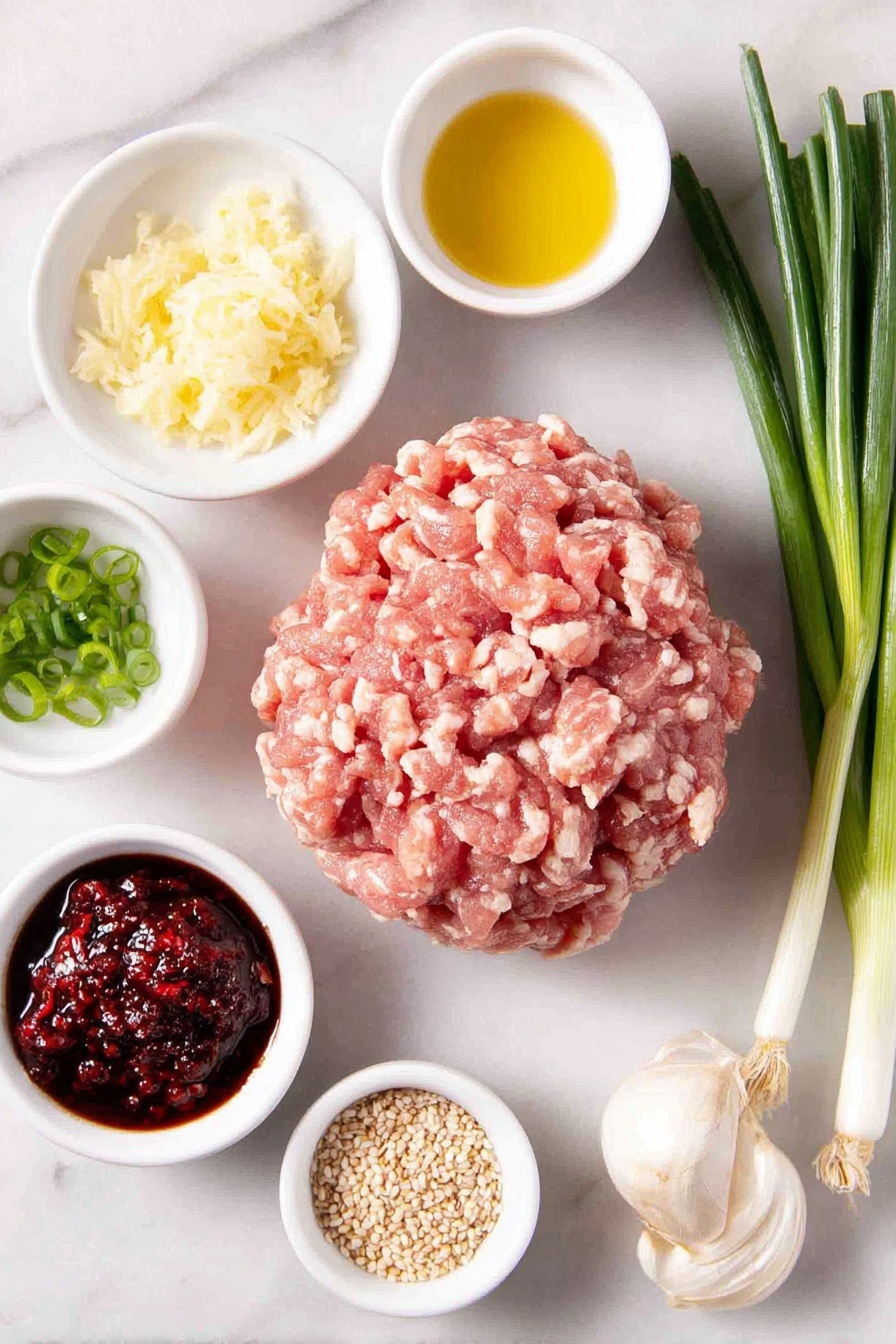 Flat lay of a mound of fresh ground chicken showing light and dark meat, a small bunch of whole scallions with green and white parts, a small white bowl with freshly grated ginger and juice, a small white bowl with grated garlic cloves, two small white bowls each containing gluten-free tamari sauce, a small white bowl with golden avocado oil, a few thinly sliced scallions arranged neatly, a small white bowl with rich red chili sambal, a small white bowl with toasted sesame seeds, all balanced symmetrically and placed on a clean white marble surface, soft natural light, photo taken with an iPhone, professional food photography style, fresh ingredients, white ceramic bowls, no bottles, no duplicates, no utensils, no packaging --ar 2:3 --v 7 --p m7354615311229779997 - Asian Chicken Meatballs, Asian Chicken Meatballs Recipe, Healthy Chicken Meatballs, Quick Asian Dinner, Easy Meatball Recipes