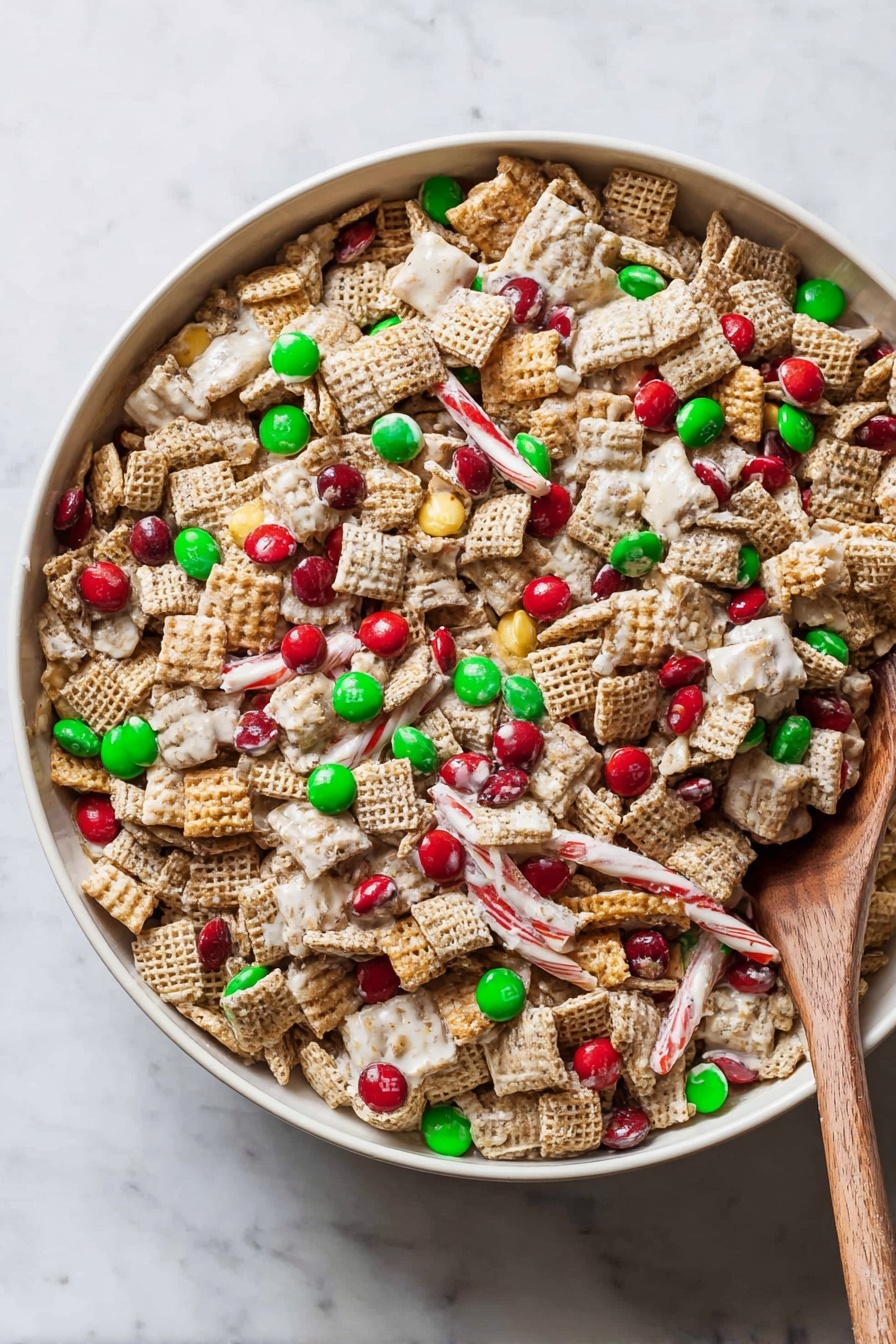 A large white bowl filled with a colorful snack mix showing a mix of light brown square cereal pieces, white-coated sticks, and red and green candy-coated chocolates scattered evenly throughout. The texture is crunchy with clusters of cereal and white coating binding some pieces together. A light brown wooden spoon is partially buried inside the mix on the right side of the bowl. The bowl sits on a white marbled surface. photo taken with an iphone --ar 2:3 --v 7 - Chex Christmas Mix, Christmas snack, holiday snack mix, festive snack recipes, easy holiday treats