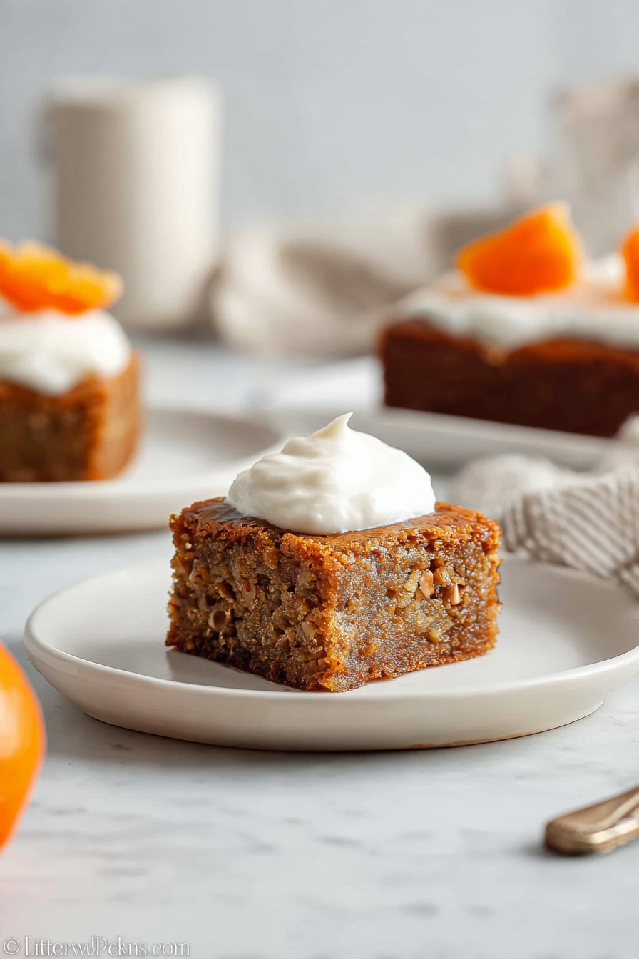A square piece of brown cake with small nut bits visible inside is placed on a white plate. On top of the cake, there is a dollop of smooth white cream. The texture of the cake looks moist and soft, and the edges are slightly darker, indicating it is well baked. In the background, there is another piece of the same cake with cream and a small orange slice on top, also on a white plate. The setting is on a white marbled surface with soft natural light, creating a clean and cozy atmosphere. Photo taken with an iphone --ar 2:3 --v 7 - Persimmon Pudding Cake with Nuts, persimmon dessert recipes, moist persimmon cake, easy autumn dessert, nut-topped pudding cake