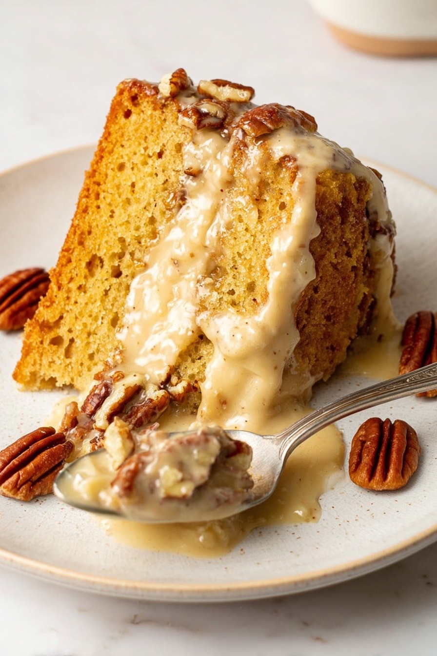 A slice of moist, golden-brown cake sits on a white plate with visible texture and small air pockets on the top layer. The middle layer is creamy and light beige, oozing slightly onto the plate. Scattered around the cake and on the spoon are several glossy, brown pecans. The spoon holds a portion of the creamy middle layer mixed with some pecan pieces. The plate rests on a white marbled surface. photo taken with an iphone --ar 2:3 --v 7 - Sweet Potato Pound Cake with Brown Butter Glaze, moist sweet potato cake, brown butter glaze recipe, cozy dessert with sweet potato, fall flavor pound cake