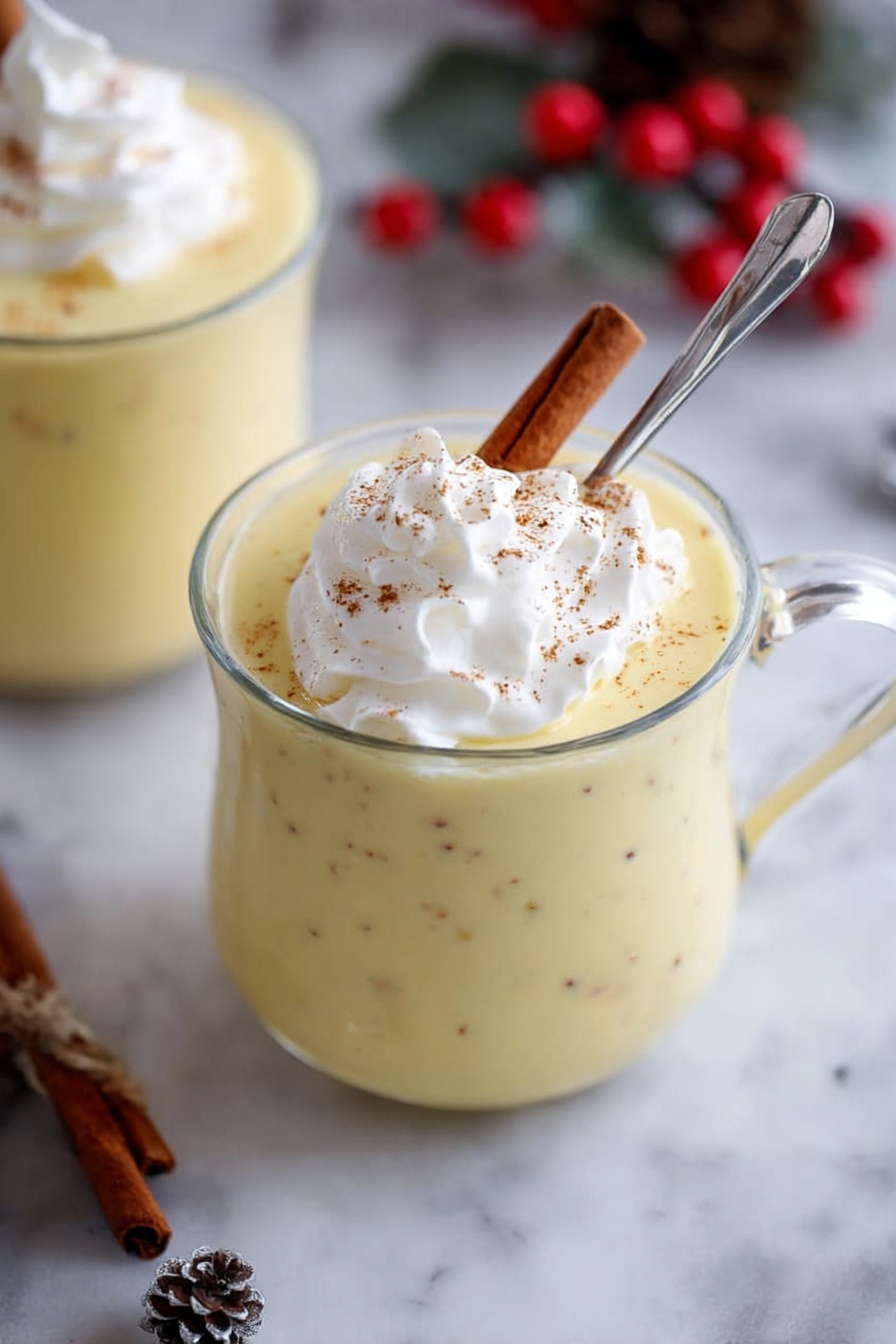 A tall, round cake with two main layers is shown. The bottom layer is darker brown with a firm texture, wrapped in white paper that is tied with a red and white checkered ribbon around the middle. The top layer is lighter brown with dark spots and a cracked surface. The top is dusted with white powdered sugar, making it look soft and fluffy. The cake sits on a round gold wire rack on a white marbled surface. There are scattered dark chocolate chips and a dusting of powdered sugar nearby, with blurred festive red balls in the background. Photo taken with an iphone --ar 2:3 --v 7 - Easy Italian Panettone, Italian panettone bread, homemade panettone, festive Christmas bread, fluffy Italian baked good