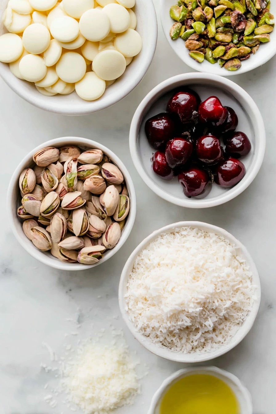 Flat lay of a small mound of smooth white chocolate discs, a few glossy red glacé cherries, a small heap of halved regular marshmallows, a handful of unsalted toasted pistachios in their natural shells, a small white bowl filled with clear grapeseed oil, and a small pile of finely shredded unsweetened desiccated coconut, all arranged symmetrically on simple white ceramic bowls and plates, placed on a clean white marble surface, soft natural light, photo taken with an iPhone, professional food photography style, fresh ingredients, white ceramic bowls, no bottles, no duplicates, no utensils, no packaging --ar 2:3 --v 7 --p m7354615311229779997 - White Chocolate Rocky Road Christmas Treat, festive holiday sweets, no-bake Christmas treats, holiday dessert ideas, seasonal chocolate dessert
