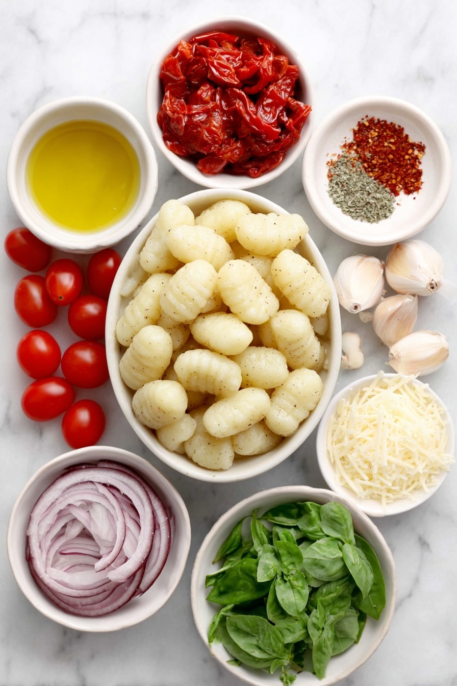 Flat lay of fresh potato gnocchi dumplings arranged neatly, a small cluster of halved cherry tomatoes showing bright red interiors, a few glossy roasted red pepper pieces chopped, thinly sliced vibrant red onion rings, three whole garlic cloves with papery skins intact, lemon zest strands curled delicately, a small white ceramic bowl with extra virgin olive oil shimmering golden, a small white bowl containing kosher salt crystals, another small bowl with freshly ground black pepper, a spaced few crushed red pepper flakes on a white surface, a small heap of thinly sliced fresh green basil leaves, and a small white ceramic bowl filled with finely grated Parmigiano-Reggiano cheese, all placed on a clean white marble surface, soft natural light, photo taken with an iPhone, professional food photography style, fresh ingredients, white ceramic bowls, no bottles, no duplicates, no utensils, no packaging --ar 2:3 --v 7 --p m7354615311229779997 - Crispy Gnocchi with Cherry Tomato Sauce, crispy gnocchi, cherry tomato dish, quick gnocchi recipe, easy pasta with cherry tomatoes