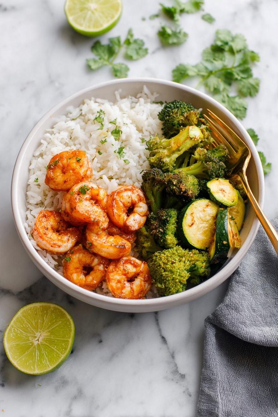 A white bowl on a white marbled surface holds a meal with three main layers: at the bottom is a base of plain white rice, topped on one side with vibrant orange cooked shrimp with a slight glaze, arranged in a small cluster. On another side of the bowl there are bright green cooked broccoli florets with a slightly roasted texture. The last section contains green and yellow cooked zucchini slices, showing a soft texture with slight grill marks. A gold fork rests inside the bowl on the right side, and fresh cilantro leaves are scattered in the background. A gray napkin is placed to the right of the bowl, and a halved lime sits on the surface near the bottom left corner. Photo taken with an iphone --ar 2:3 --v 7 - Spicy Shrimp Bowl with Vegetables, healthy shrimp bowl, quick seafood meal, flavorful vegetable bowl, easy shrimp and rice dish