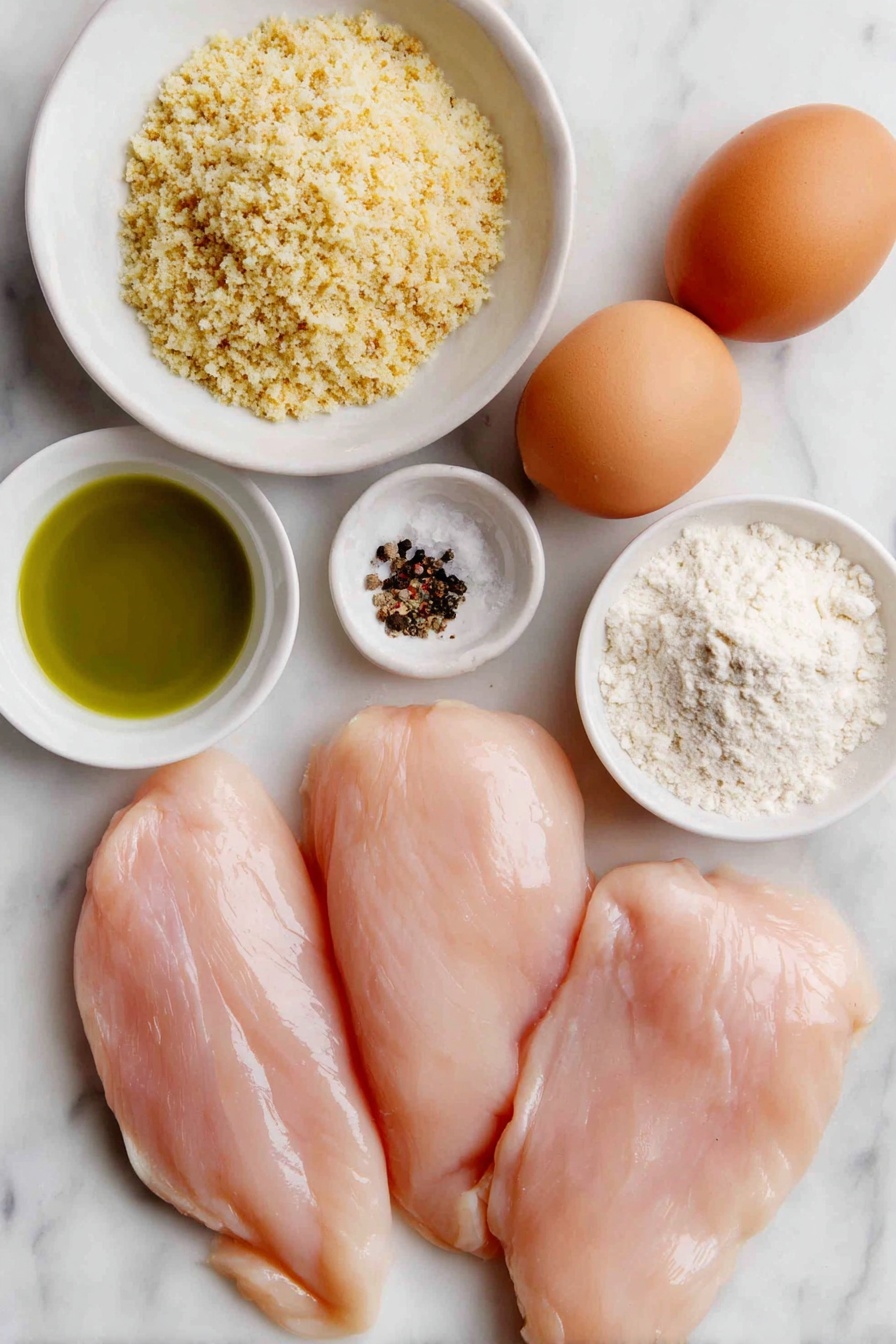 Flat lay of four boneless, skinless chicken breasts, a small mound of all-purpose flour on a simple white ceramic plate, two whole brown eggs with clean shells, a white ceramic bowl with a generous mix of golden panko breadcrumbs, seasoned Italian breadcrumbs, and grated parmesan cheese, a small white bowl filled with rich green olive oil, a few scattered kosher salt crystals, and some freshly ground black peppercorns placed neatly on the clean white marble surface, soft natural light, photo taken with an iPhone, professional food photography style, fresh ingredients, white ceramic bowls, no bottles, no duplicates, no utensils, no packaging --ar 2:3 --v 7 --p m7354615311229779997 - Crispy Parmesan Chicken Breasts, crispy chicken recipes, easy chicken dinner, baked chicken with parmesan, crunchy chicken breast ideas