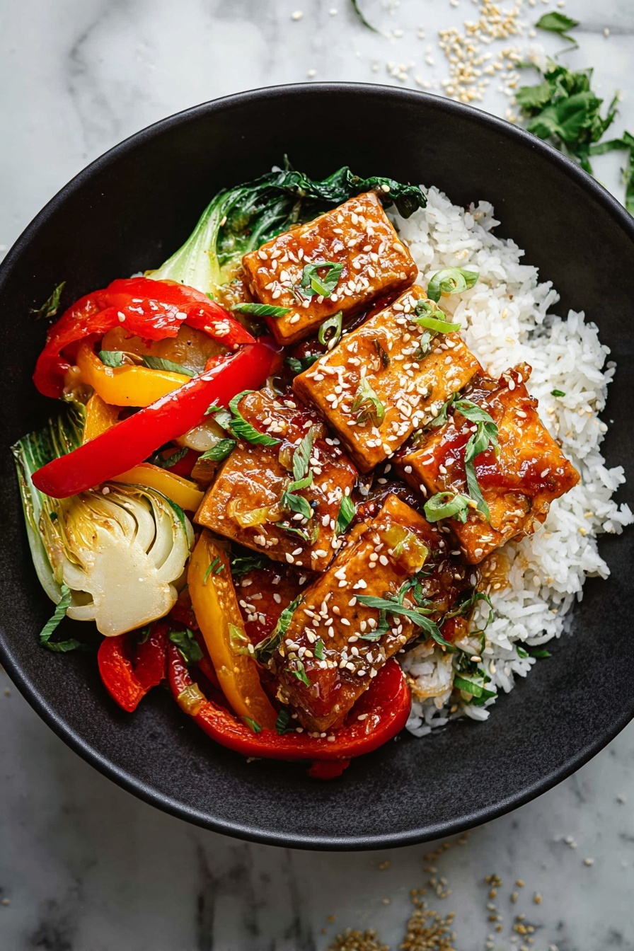 A white bowl holds a colorful dish with three main layers; the bottom layer is white rice with soft, small grains; the middle layer has cooked mixed vegetables including red and yellow bell pepper strips and light green bok choy pieces, all with a slightly glossy, saucy coating; the top layer features several rectangular golden-brown tofu pieces sprinkled with white sesame seeds and small green herb leaves, adding a fresh touch. The bowl is set on a white marbled surface with small bits of herbs and sesame scattered around. photo taken with an iphone --ar 2:3 --v 7 - Flavorful Tofu Stir Fry, tofu stir fry recipe, healthy stir fry dish, crispy tofu with savory sauce, vegan tofu stir fry