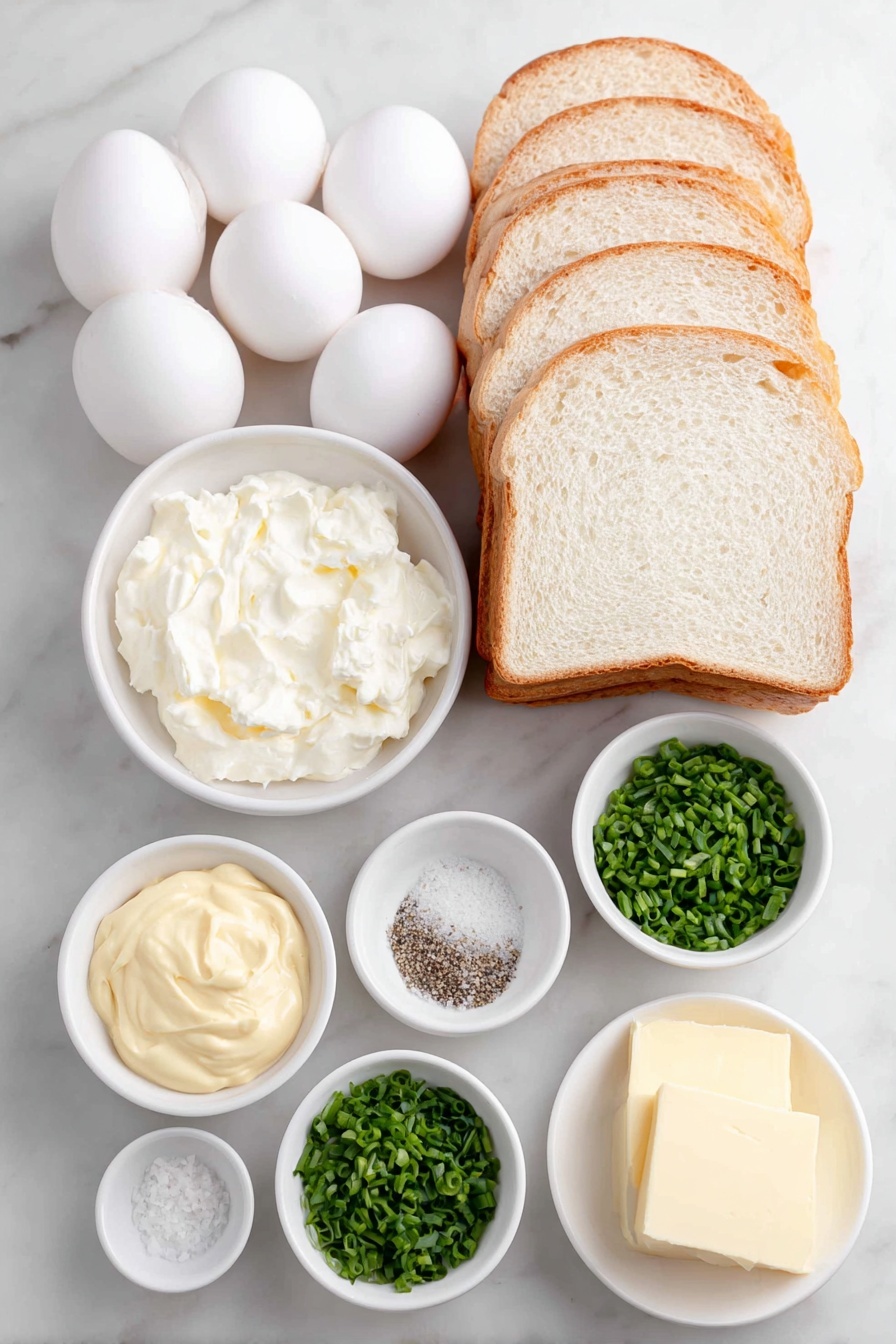 Flat lay of six whole soft boiled eggs with clean shells, a small white ceramic bowl of creamy whole egg mayonnaise, a small white bowl of smooth Dijon mustard, a small white bowl with finely chopped bright green chives, a small white bowl with coarse black pepper, a small white bowl containing fine kosher salt, eight slices of fresh soft white sandwich bread arranged neatly in a stack, and a small white bowl of soft pale yellow salted butter, all placed on a clean white marble surface, soft natural light, photo taken with an iPhone, professional food photography style, fresh ingredients, white ceramic bowls, no bottles, no duplicates, no utensils, no packaging --ar 2:3 --v 7 --p m7354615311229779997 - Creamy Soft Boiled Egg Sandwich,soft boiled egg breakfast ideas,easy egg sandwich recipe,creamy eggs on bread,quick egg sandwich for breakfast
