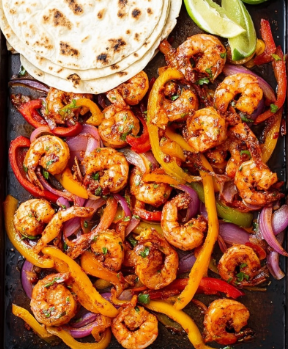 A close-up view of a metal bowl filled with raw shrimp that have a light seasoning, placed on top of colorful sliced bell peppers and thin rings of purple onion. The shrimp are pale with some brownish spice spots, arranged evenly throughout the mix. The bell peppers are yellow, red, and orange, cut into strips and mixed well with the onion rings. The bowl rests on a white marbled surface, with the mix showing a fresh and vibrant look. Photo taken with an iphone --ar 2:3 --v 7 - Sheet Pan Shrimp Fajitas, easy shrimp fajitas, healthy shrimp fajitas, quick fajitas recipe, colorful sheet pan dinner